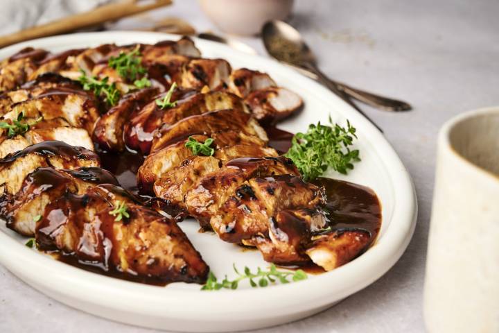 Turkey tenderloin marinade served with turkey tenderloins sliced on a plate. 